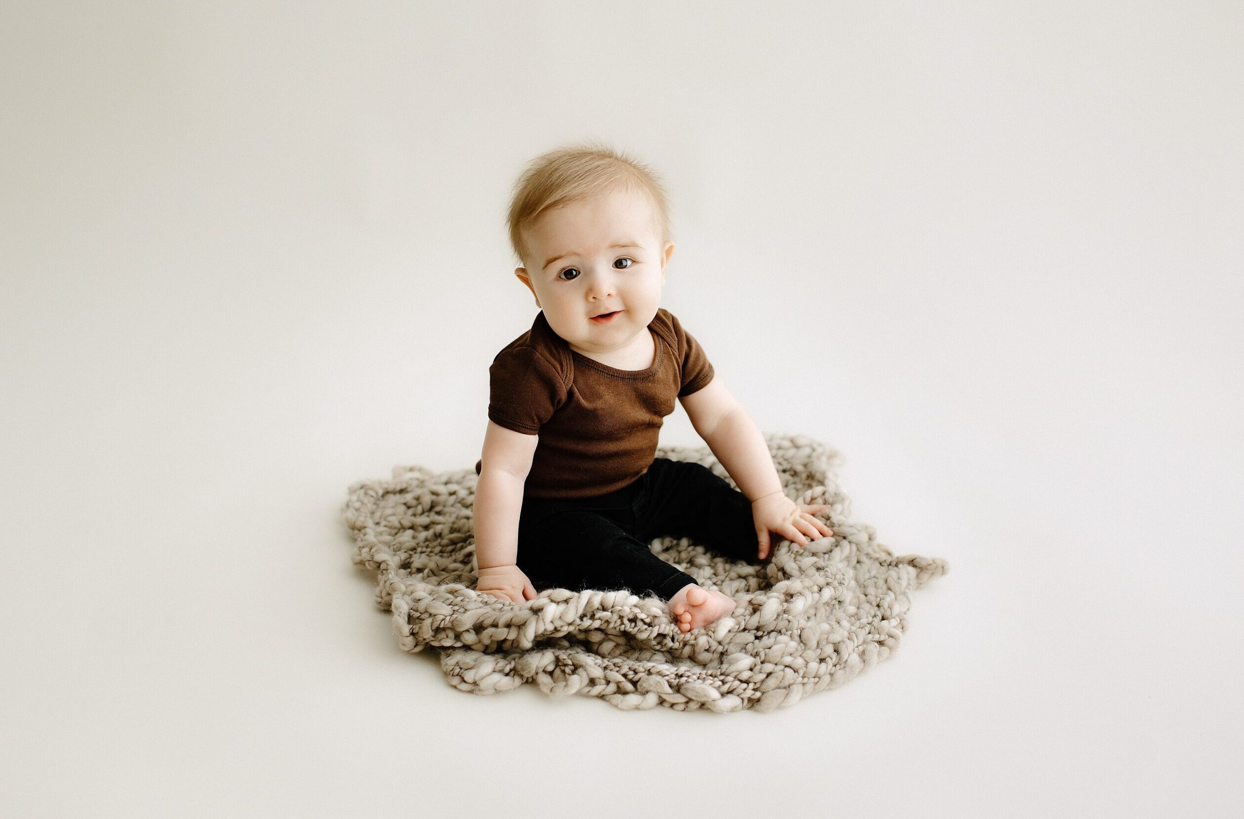 Milestone photography milestone session baby on blanket in studio in Tampa Bay, Florida Nadine B Photography