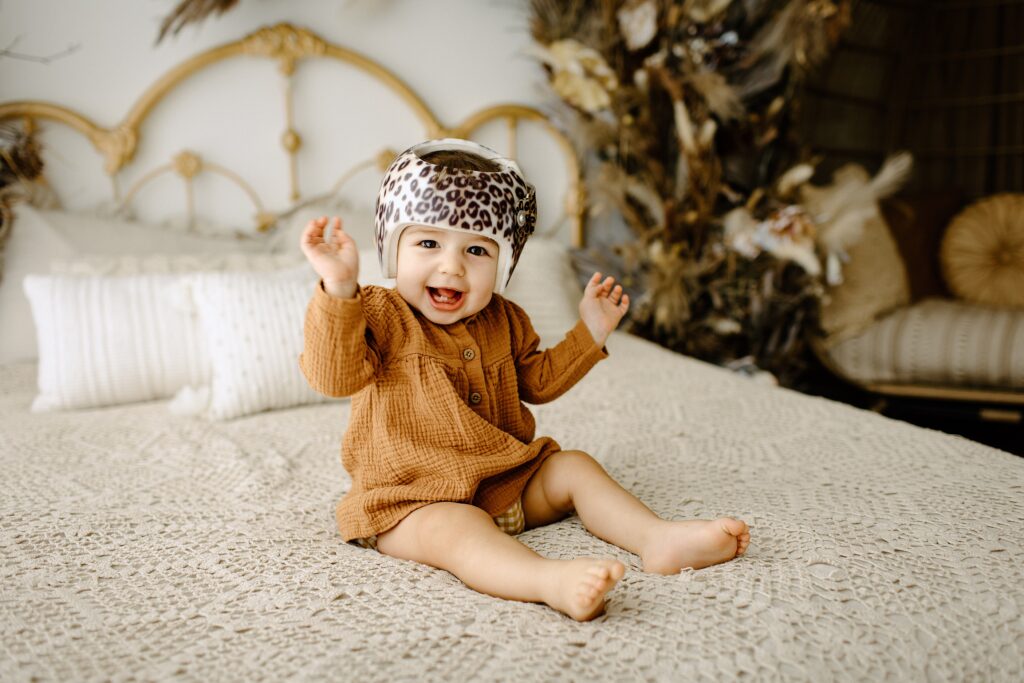Family photography milestone session with baby on bed in studio in Tampa Bay, Florida Nadine B Photography 