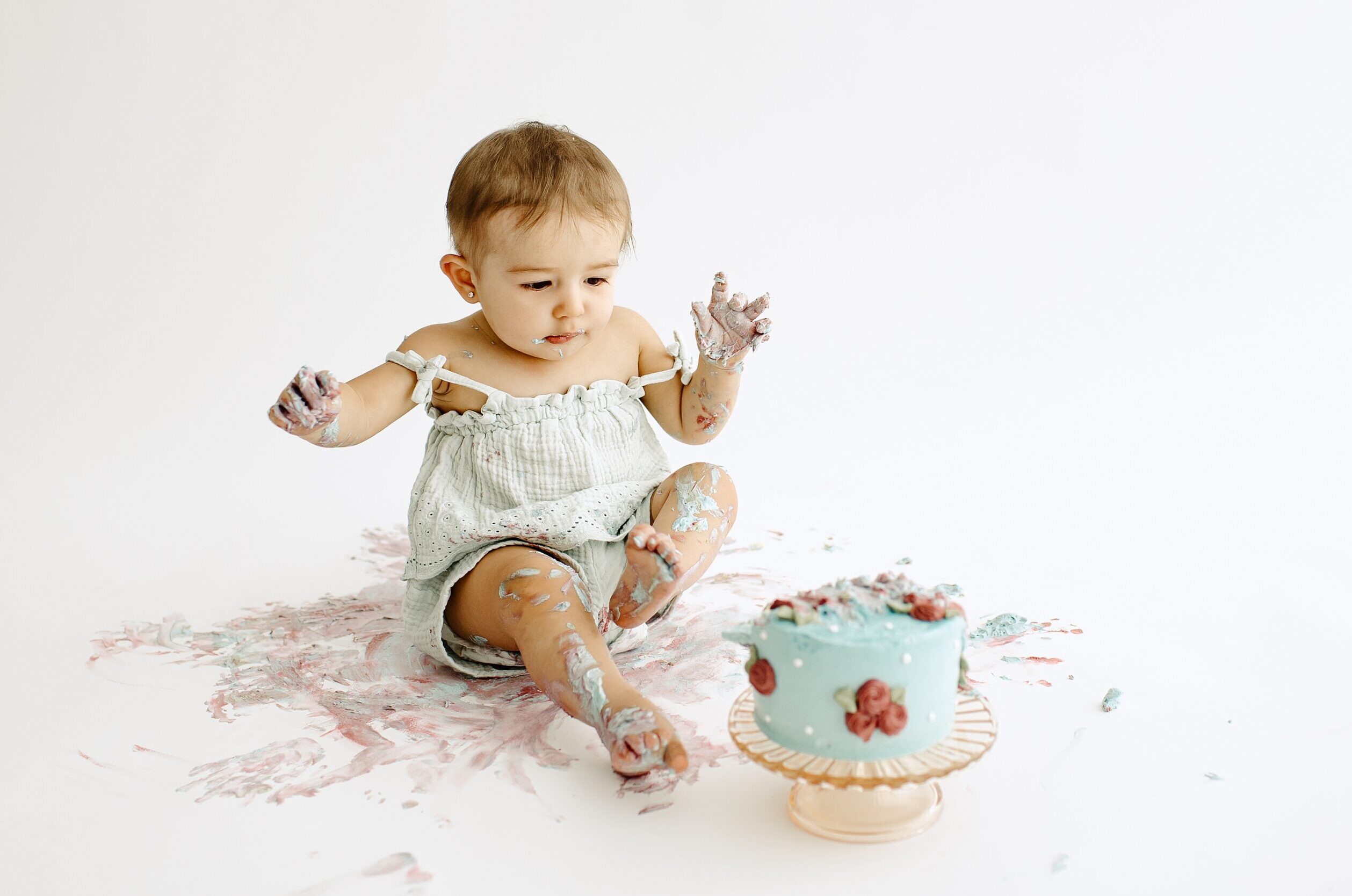 Family photography milestone session with baby and cake in studio in Tampa Bay, Florida Nadine B Photography