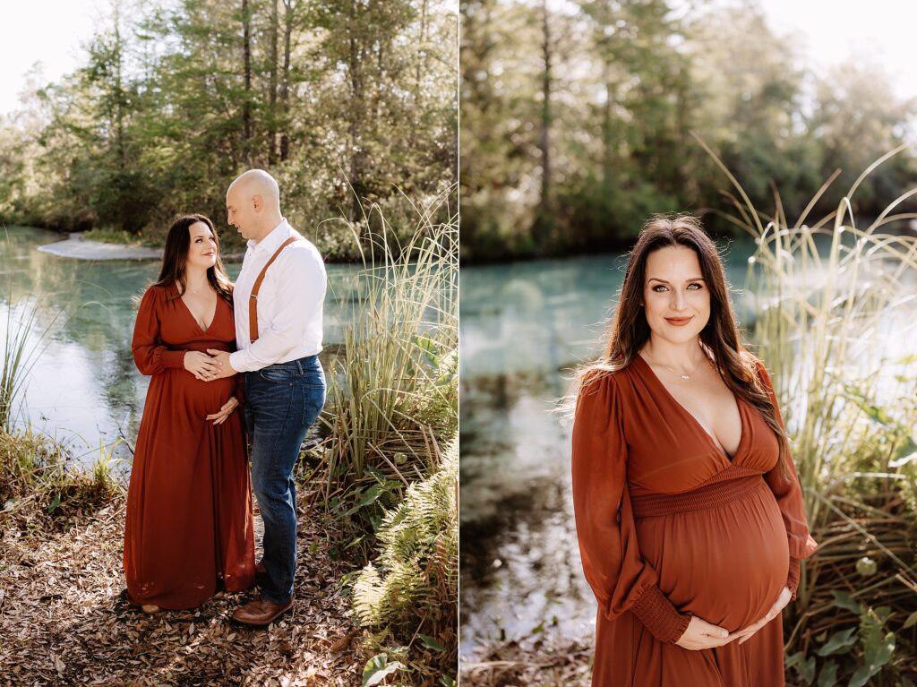 Expecting couple standing near Florida spring, gazing at each other lovingly with mom cradling her baby bump in rust-colored gown