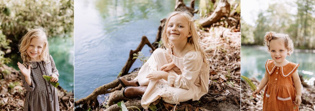 Three sisters smiling and playing beside spring water, each wearing unique neutral-toned dresses in a whimsical woodland setting