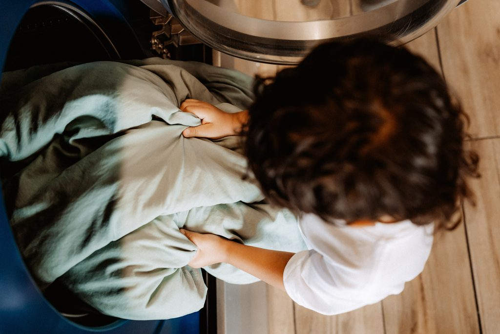 Lifestyle branding photography featuring family moments at Dirty Britches Laundromat in Spring Hill, Florida