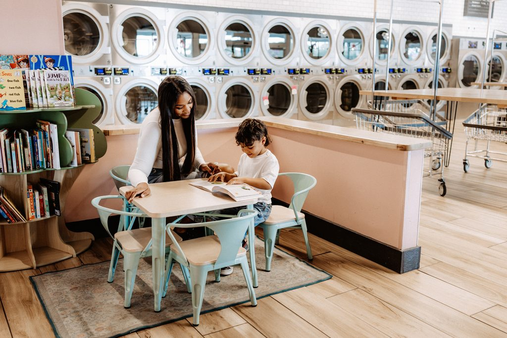 Lifestyle branding photography featuring family moments at Dirty Britches Laundromat in Spring Hill, Florida