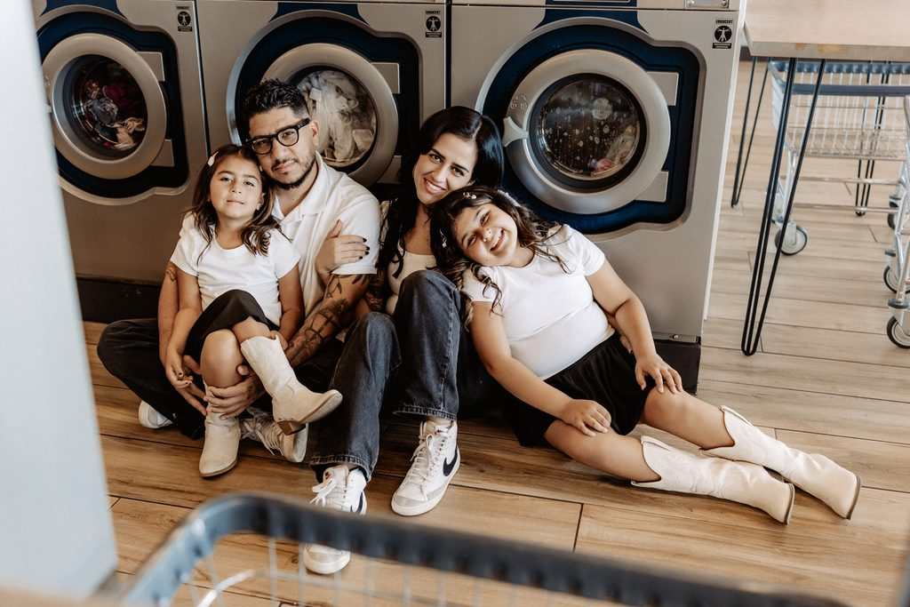 Lifestyle branding photography featuring family moments at Dirty Britches Laundromat in Spring Hill, Florida