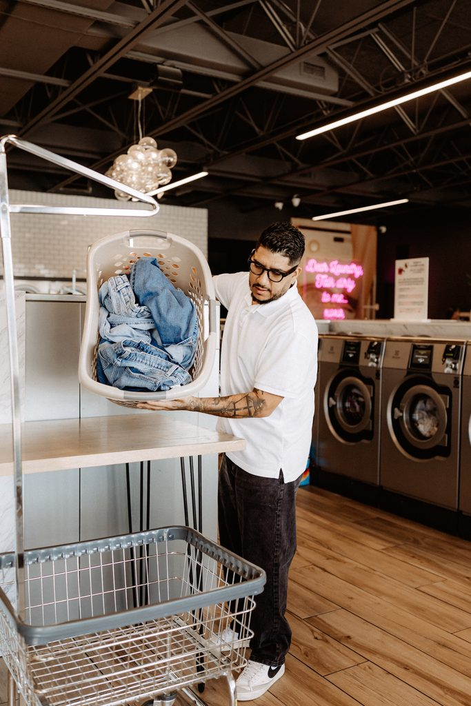 Lifestyle branding photography featuring family moments at Dirty Britches Laundromat in Spring Hill, Florida