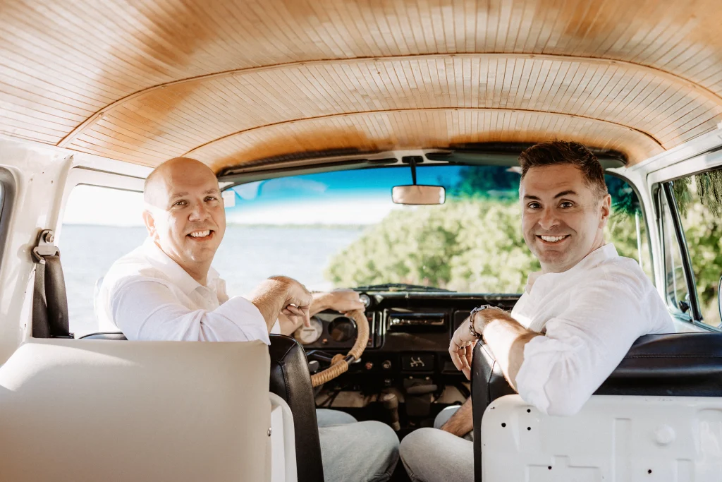 Christmas mini session setup with a decorated turquoise vintage blue bus on St. Pete Beach, Florida.
