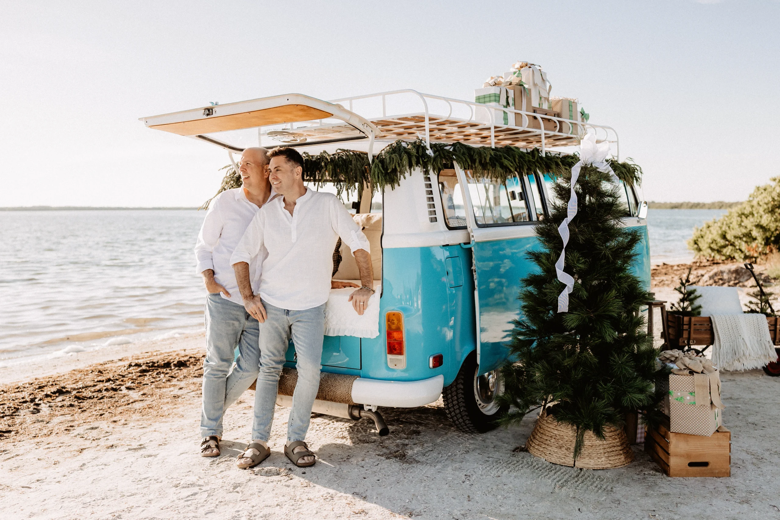 Christmas mini session setup with a decorated turquoise vintage blue bus on St. Pete Beach, Florida.