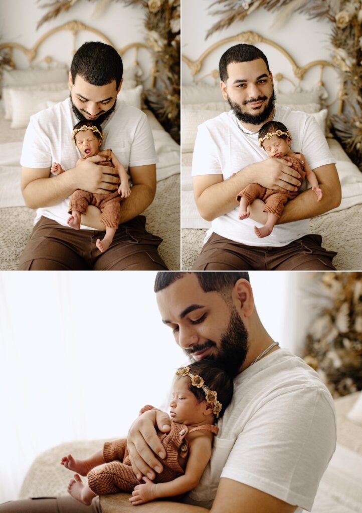 Newborn photography family session man with baby on bed in studio in Tampa Bay, Florida Nadine B Photography