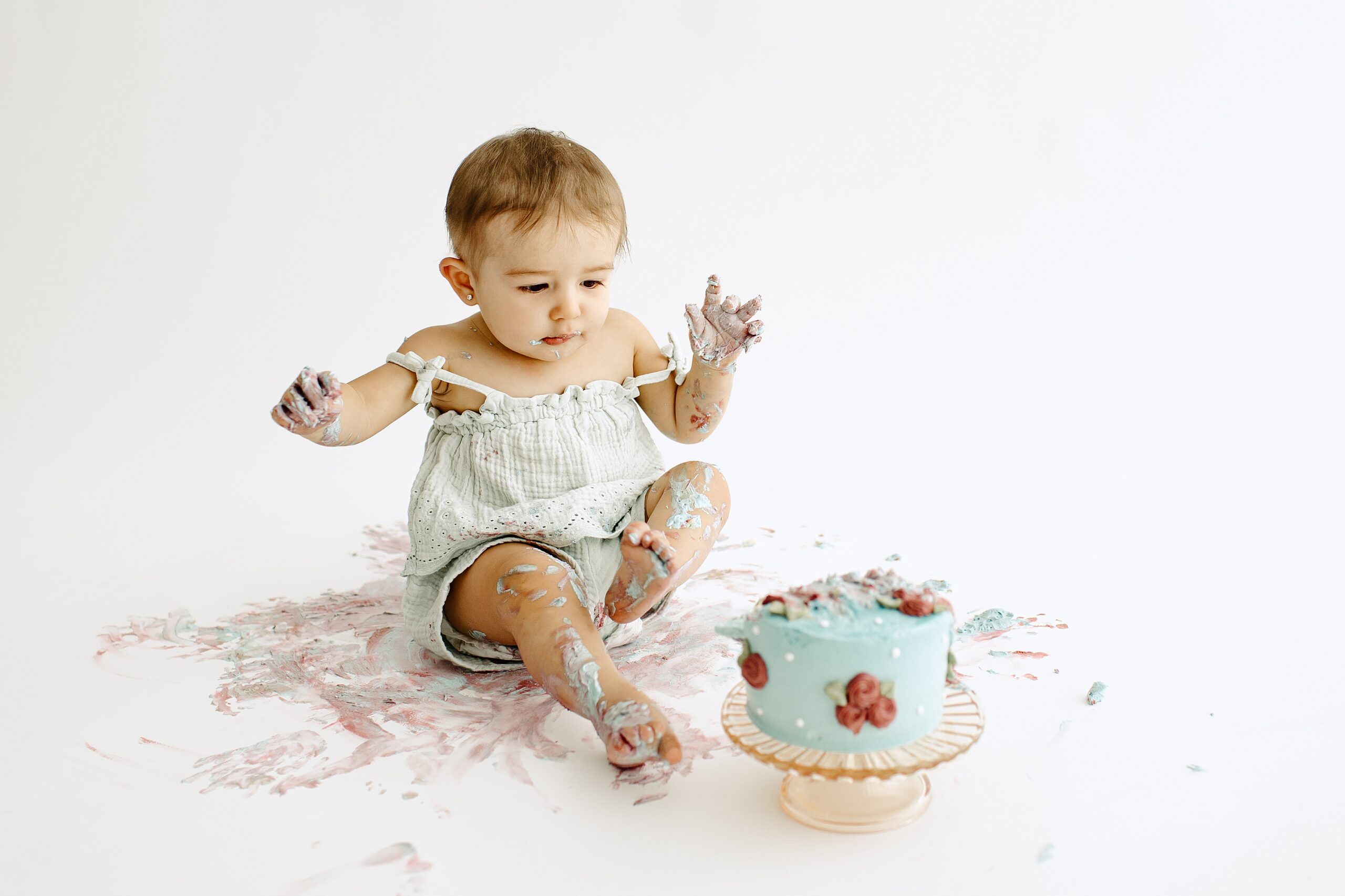 Family photography milestone session with baby and cake in studio in Tampa Bay, Florida Nadine B Photography