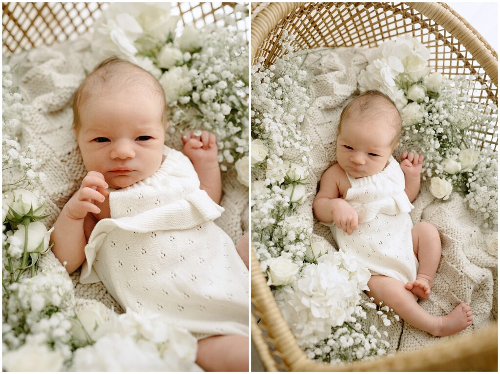 Newborn baby girl peacefully relaxing, surrounded by delicate baby's breath flowers, in a serene studio setting