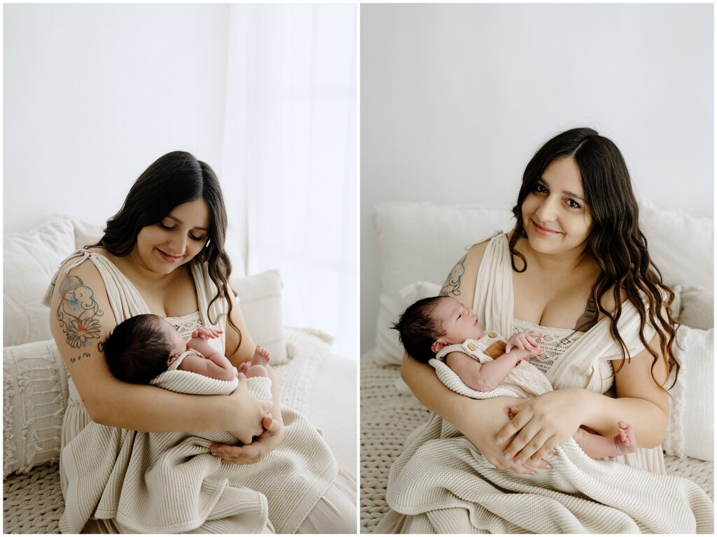 Newborn baby boy cuddling with mom in beige dress in studio