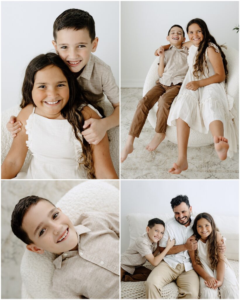 Brother and sister laughing during newborn family session in Springhill Florida studio