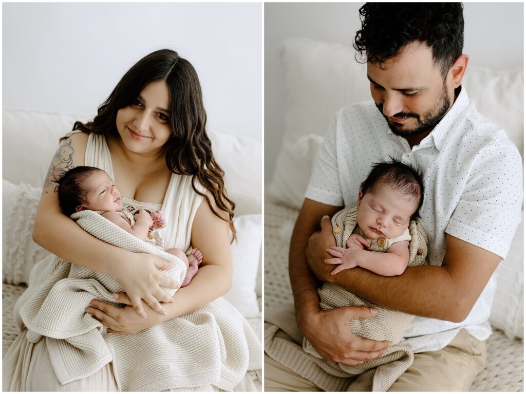 Mom and dad holding newborn baby while sleeping in arms in Springhill Florida studio