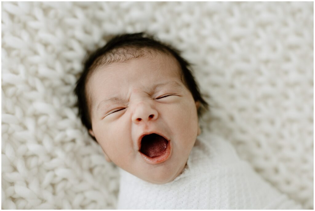 Yawning portrait of newborn baby boy in Springhill Florida studio