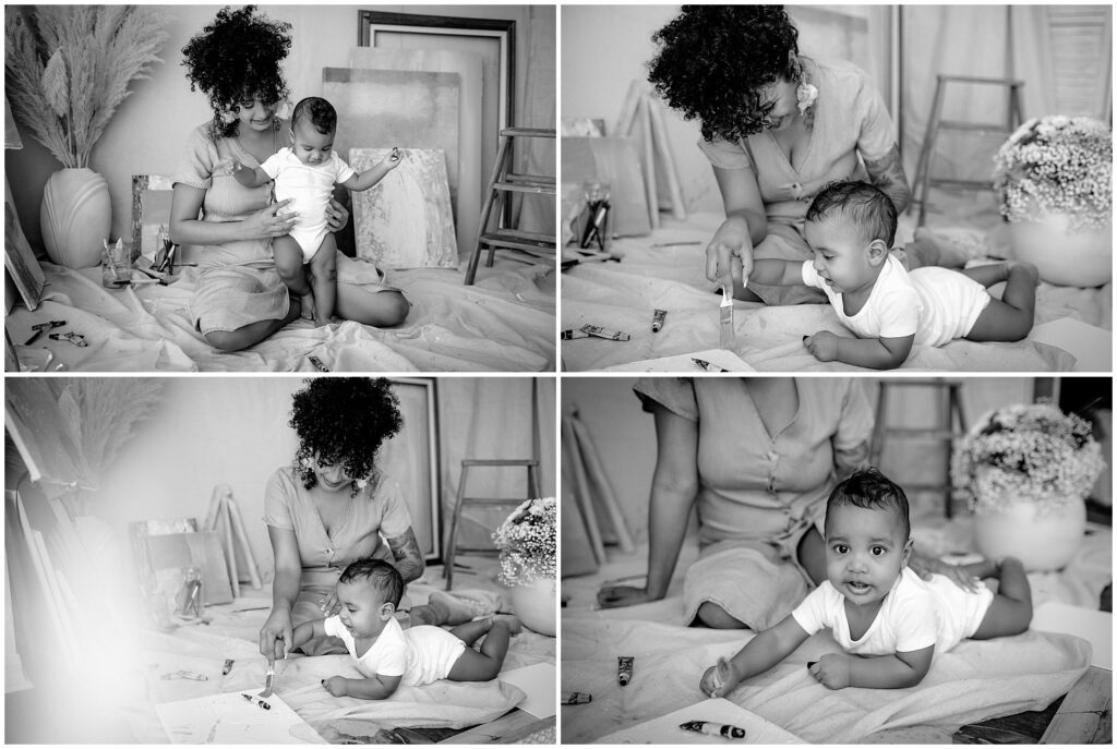 black and white portrait of Artistic mom and son with canvases and blue paint at springhill florida photography studio