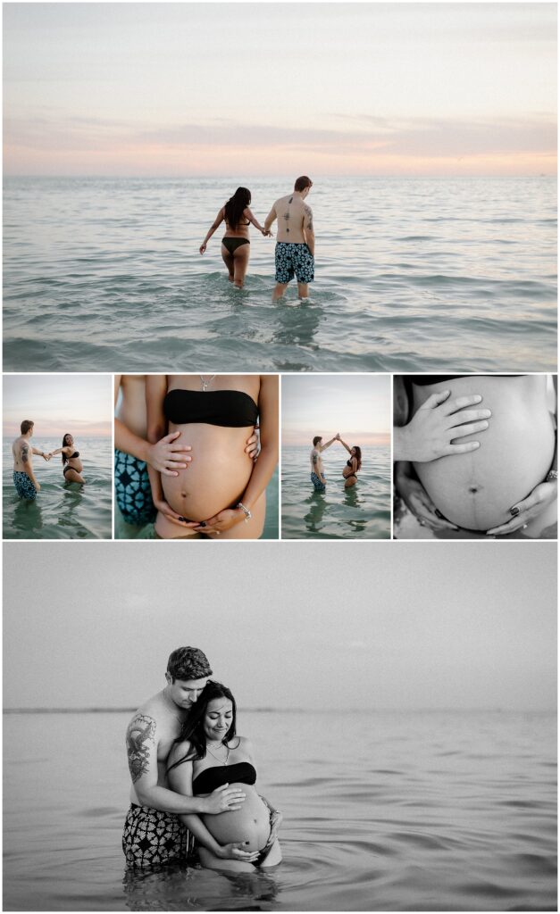 Maternity session of mom in black bikini and dad wearing board shorts while playing in water at sunset in springhill florida at beach