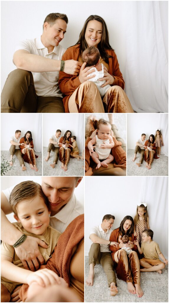 Smiling family with newborn baby girl during their photography session at springhill florida photography studio