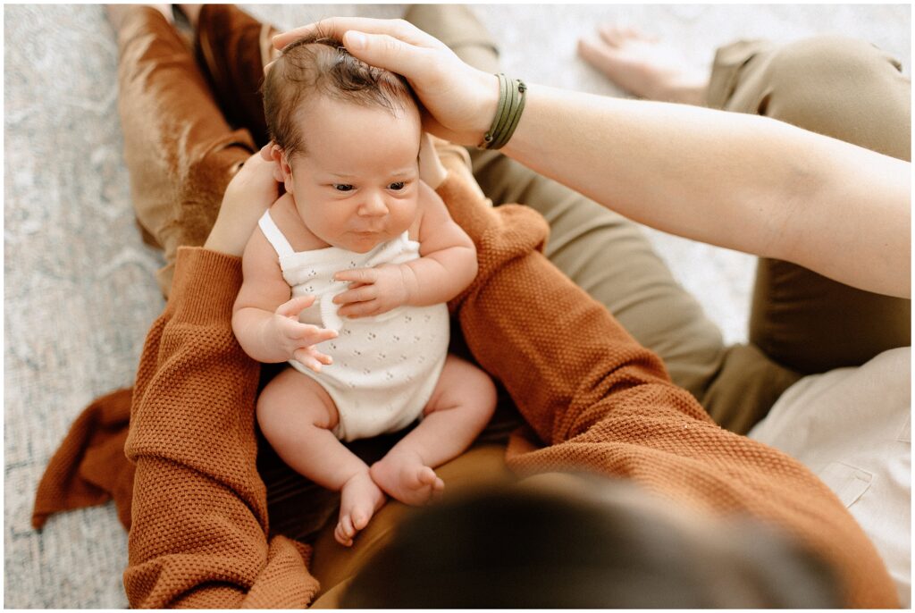 Newborn family photography session capturing smiles and laughter at springhill florida photography studio