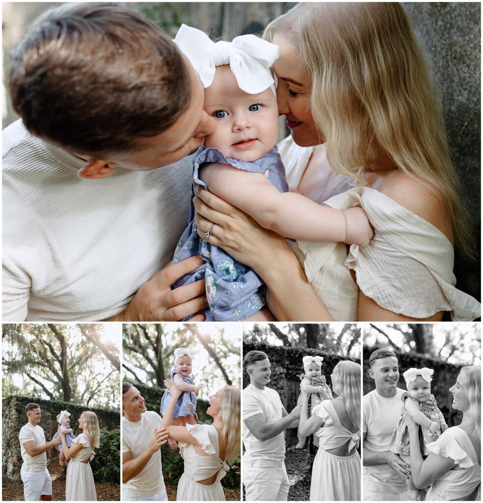 Family photo with baby in a white and blue floral dress, mom in white dress, and dad in cream shirt and white shorts.
