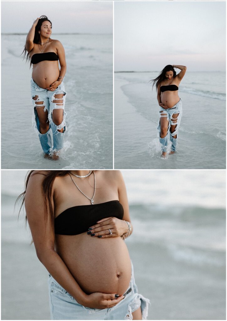 Beach maternity session of mom wearing black bikini and jeans in springhill florida