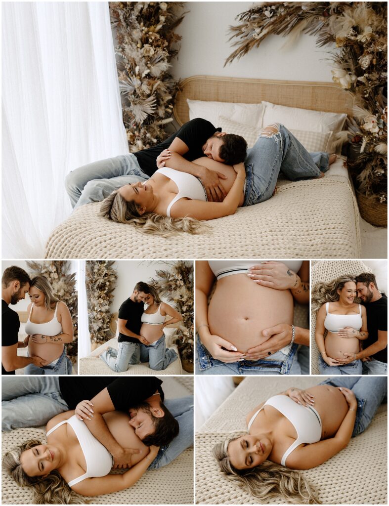 Expecting mother in jeans and white top, husband in black on boho bed at Spring Hill Studio