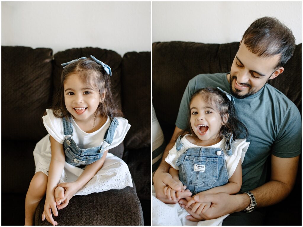 Dad holding daughter in living room during in-home newborn session