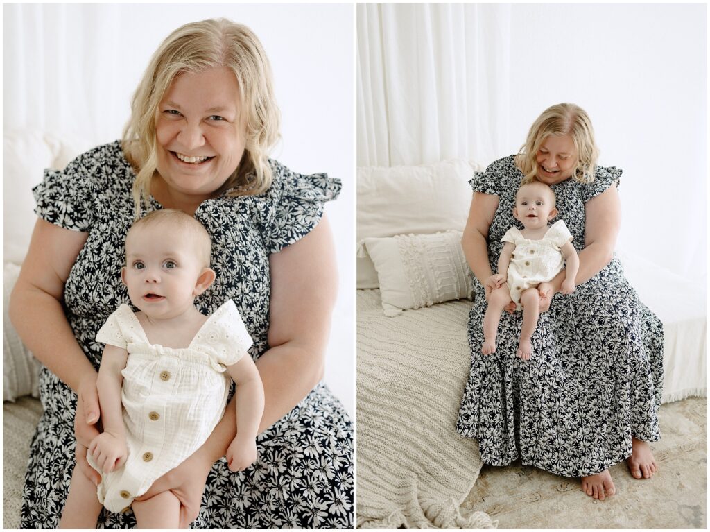 Smiling little girl with mom in floral dress sitting on bed in Spring Hill Studio in Florida