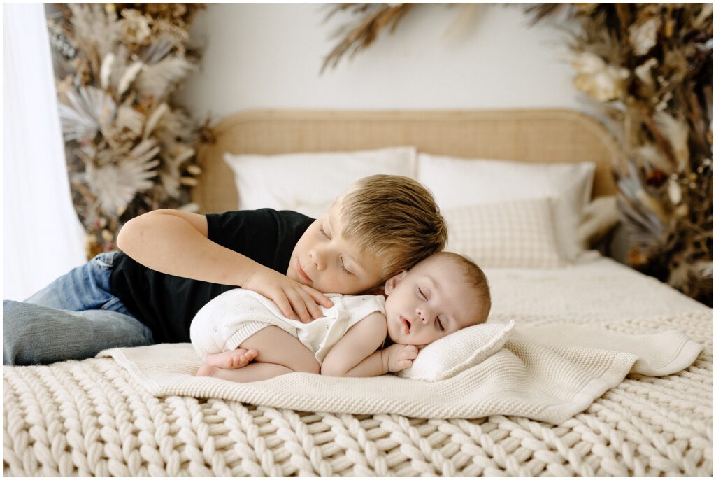 Sleeping brother and sister on bed Spring Hill Studio in Florida