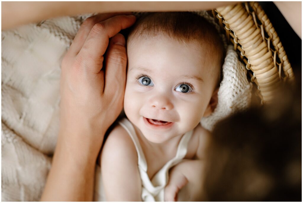 Close up portrait of smiling little girl with blue eyes looking at dad Spring Hill Studio in Florida