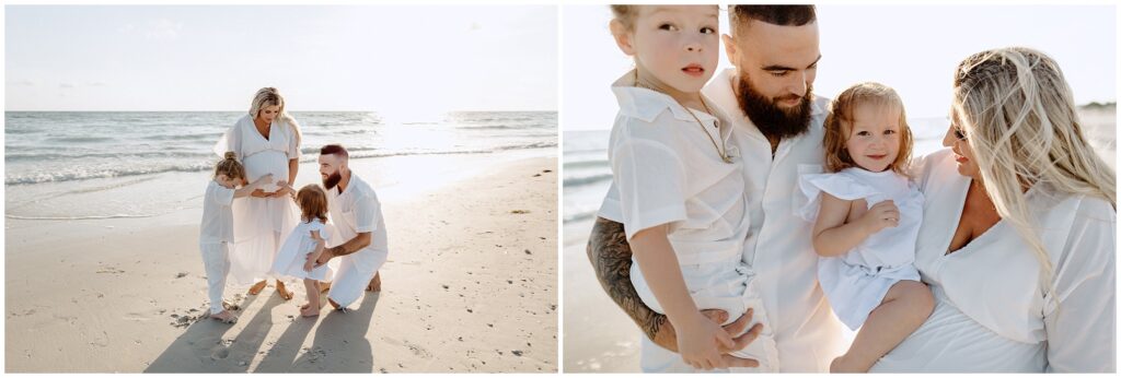 Family of four in white outfits posing on the beach during a Tampa maternity session