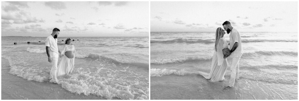 Black and white portrait of mom and dad pregnant in water on Tampa Beach