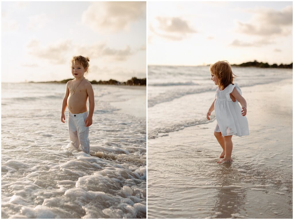 Daughter and son playing in white outfits at Tampa beach in water 