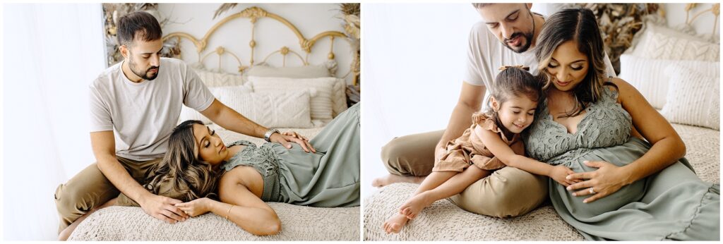 Family portraits of pregnant family sitting on bed holding belly at Vibe Studio Spring Hill in Florida