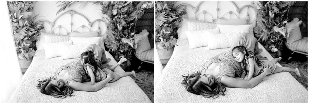 Black and white image of mom snuggling with little girl on bed at Vibe Studio Spring Hill in Florida