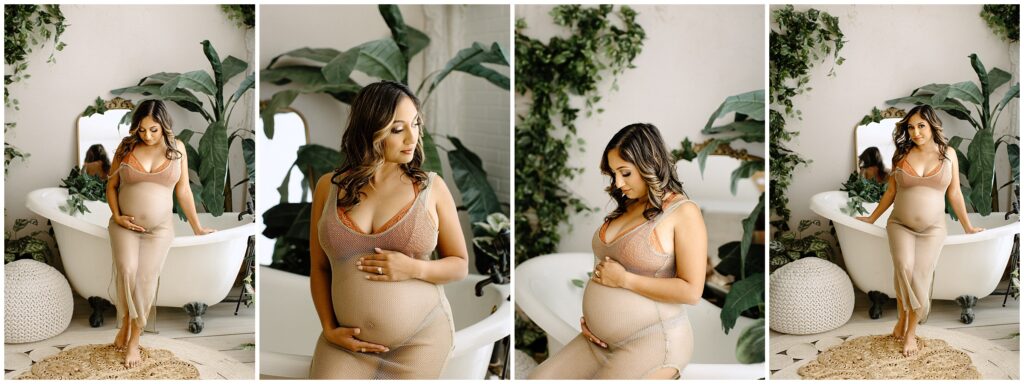 Pregnant woman in nude dress sitting on white clawfoot tub holding belly at Vibe Studio Spring Hill in Florida