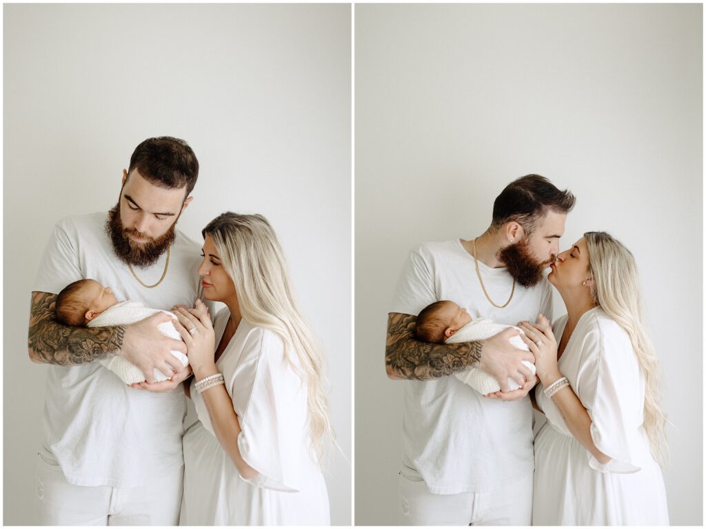 Close up images of dad holding newborn baby boy while kissing mom in home newborn lifestyle photo session in Florida