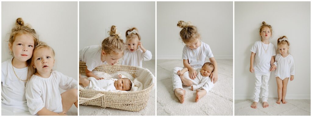 Big brother and sister wearing white while playing with their newborn sibling during in home newborn lifestyle