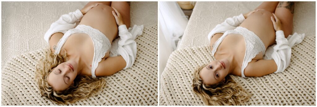 Close up portraits of blonde woman during maternity session holding pregnant belly in white top on bed 