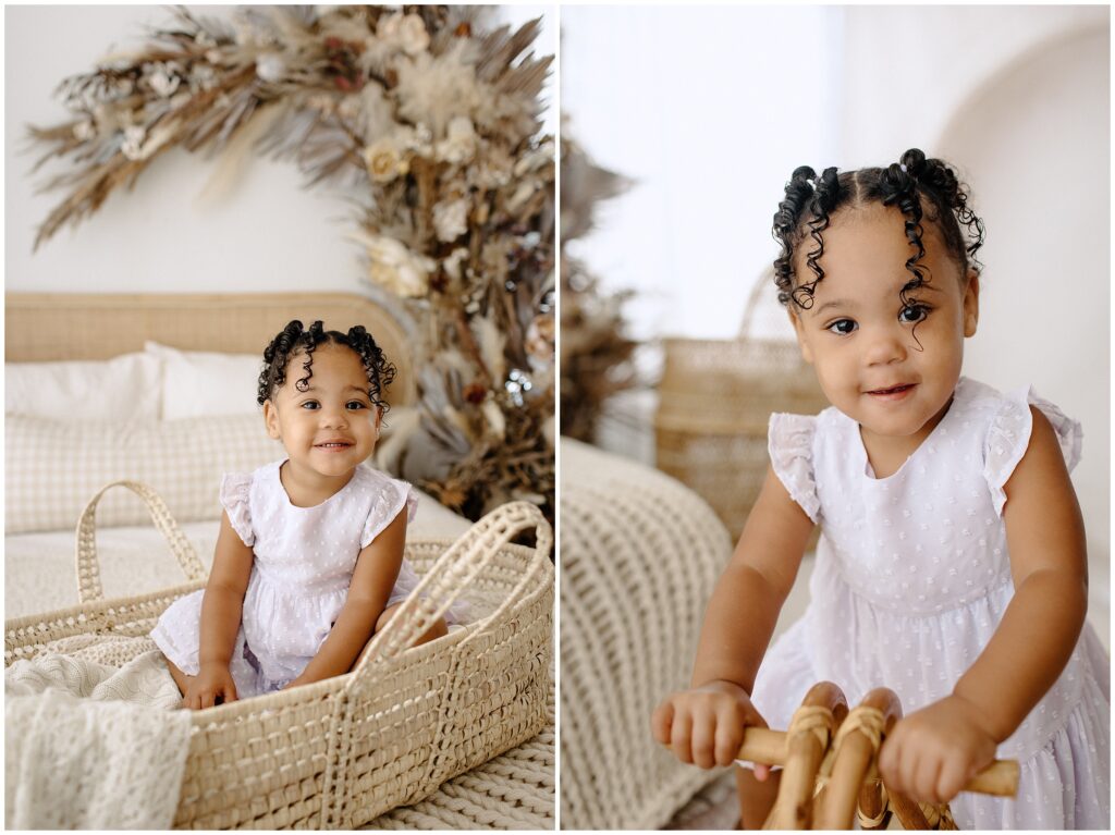 Big sister in white dress playing during newborn session at Spring Hill Studio in Florida