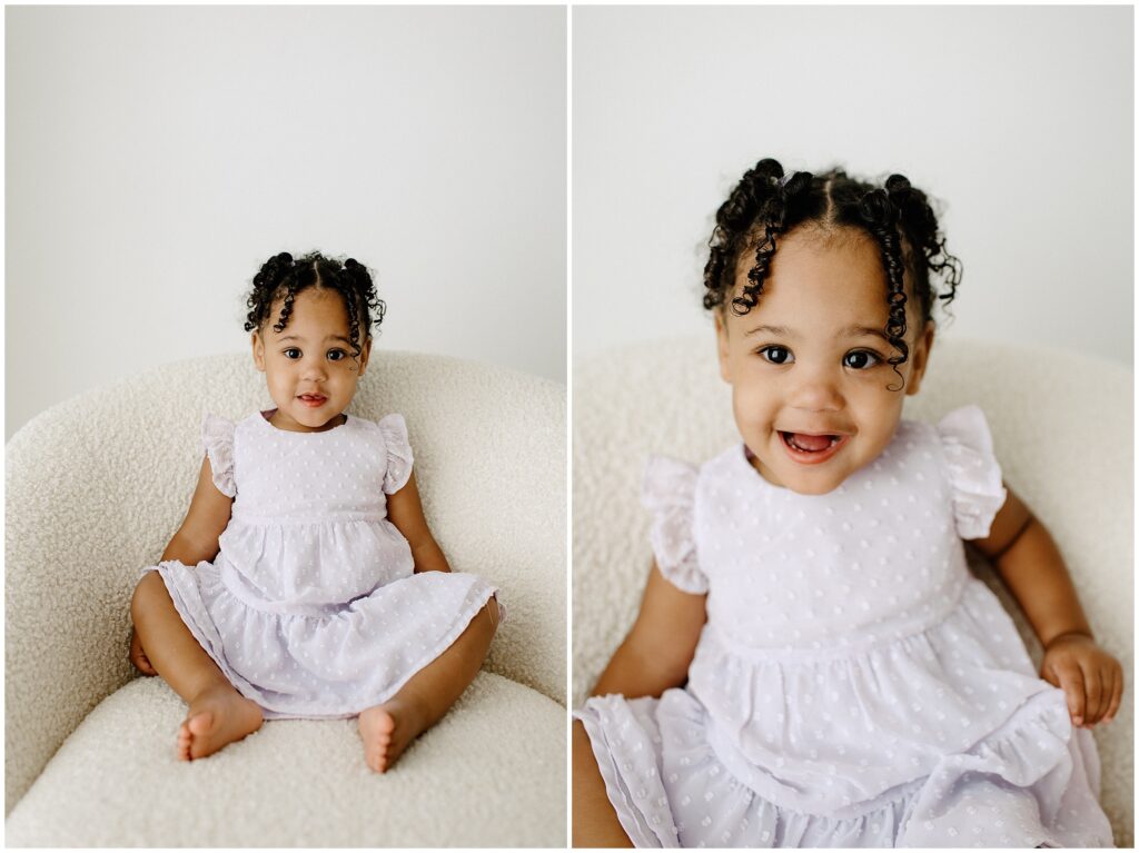 Smiling big sister in white dress on white chair newborn session at Spring Hill Studio in Florida