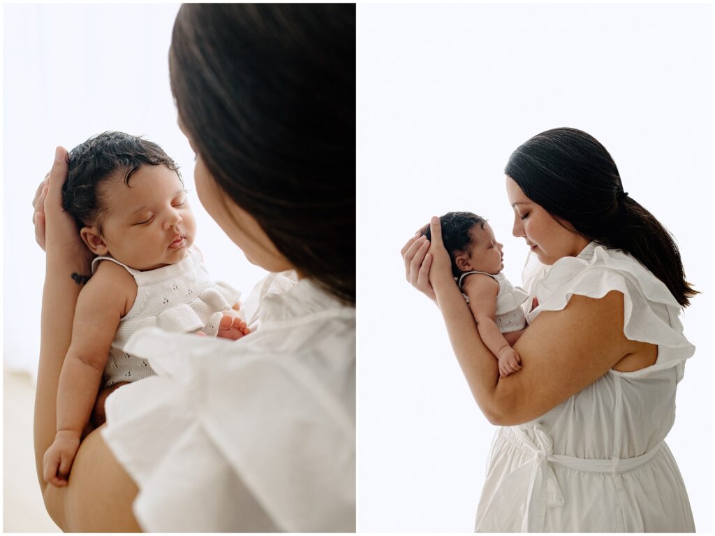 Close up portraits of mom holding baby girl in white dresses during newborn session at Spring Hill Studio in Florida