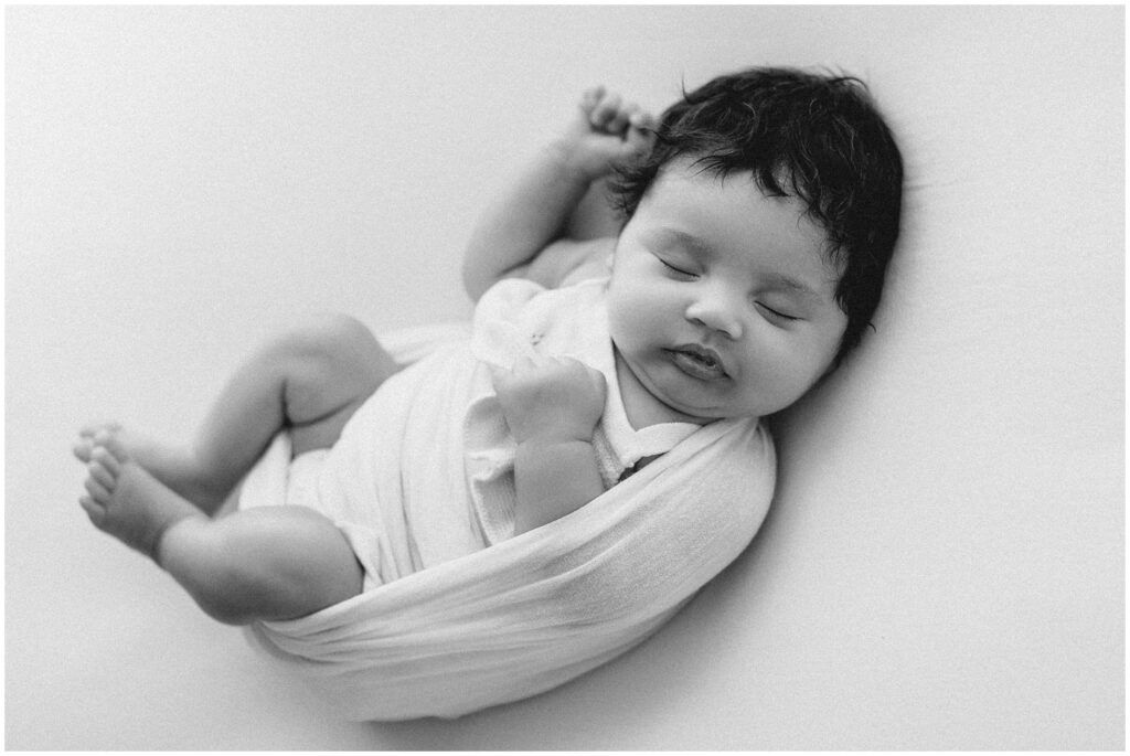 Black and white portrait of sleeping baby girl newborn session at Spring Hill Studio in Florida